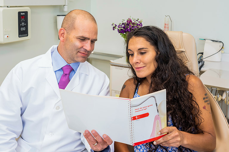 A patient going over her treatment plan with her doctor